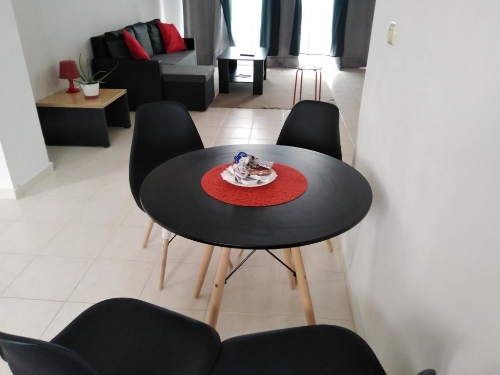 Posezení v ubytování STUDIOS POSEIDONIA apartments 50 & 70 sqm with sea view