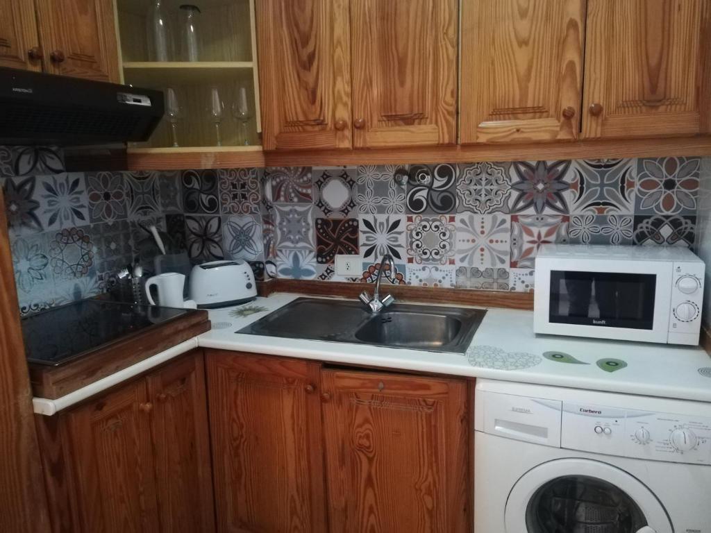 Kuchyň nebo kuchyňský kout v ubytování Vacaciones Alondras Park D209