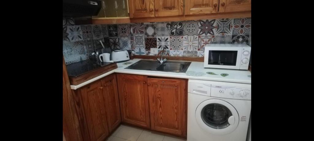 Kuchyň nebo kuchyňský kout v ubytování Vacaciones Alondras Park D209