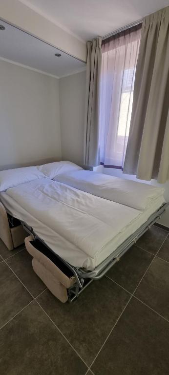Postel nebo postele na pokoji v ubytování Antica locanda al Gelso