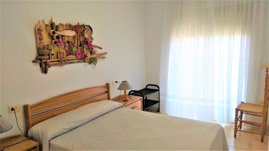 A bed or beds in a room at PEÑISMAR FiNCAS VAN CAMP