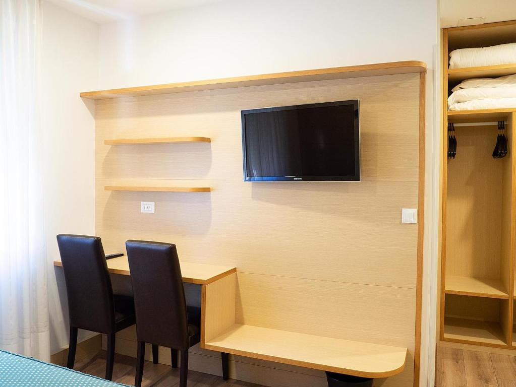 TV a/nebo společenská místnost v ubytování Al Benvenuto Hotel & Restaurant