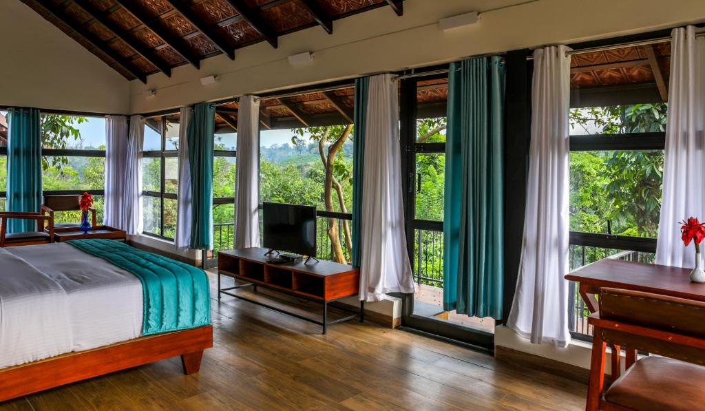 Postel nebo postele na pokoji v ubytování Pranavam Resort & Spa