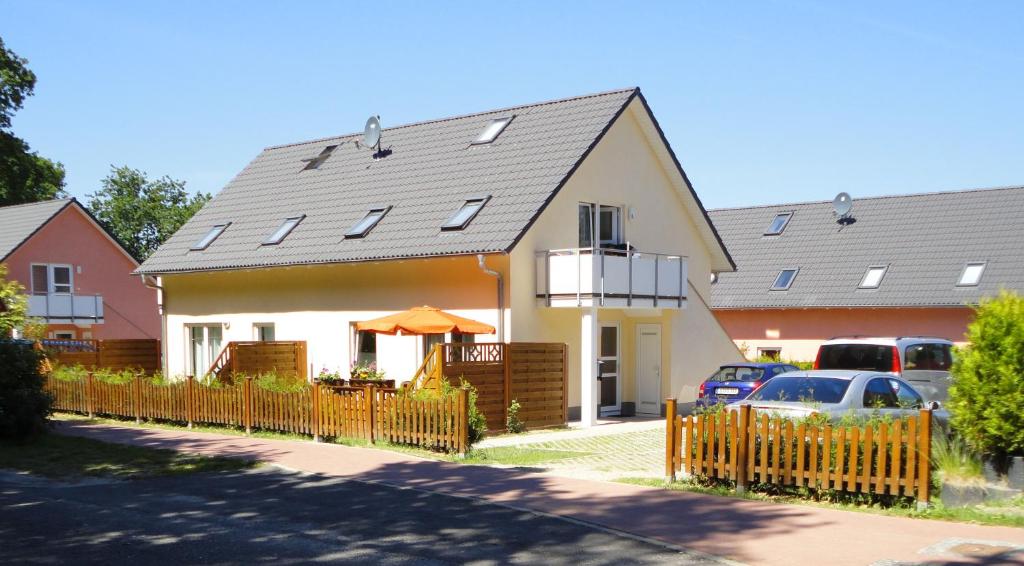 a house with solar panels on the roof at Apartment Neptun in Ueckeritz