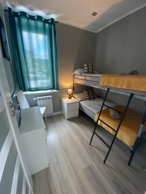 Posteľ alebo postele v izbe v ubytovaní Apartamenty Ogrodowa14