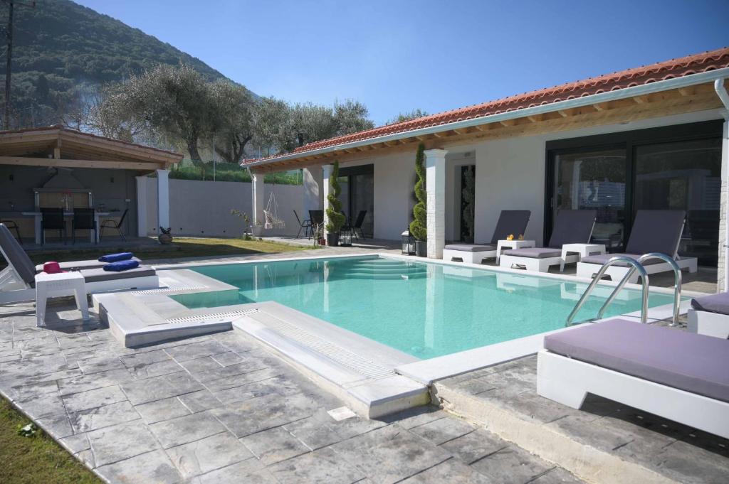 The swimming pool at or close to Diamond Luxury Villa Corfu 6 Bedroom Luxury Villa