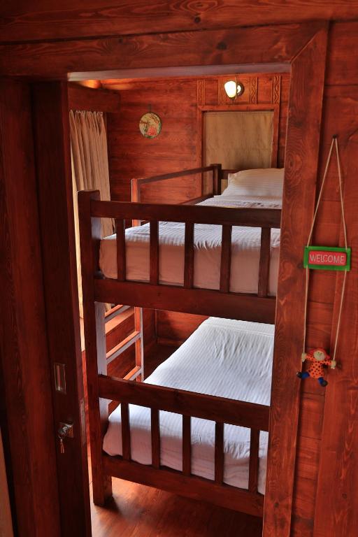Postel nebo postele na pokoji v ubytování Accord Highland Hotel Ooty