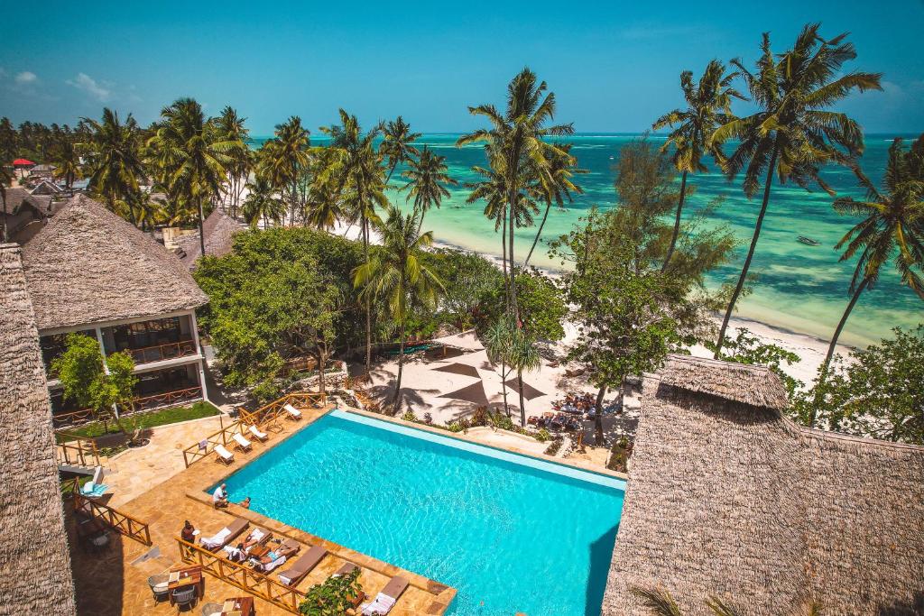 an aerial view of a resort with a swimming pool and the beach at Zanzibella Hotel & SPA in Kiwengwa