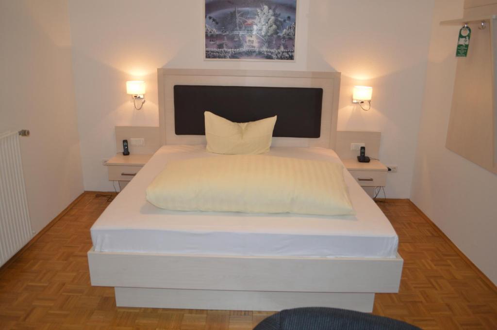 Postel nebo postele na pokoji v ubytování Hotel Scirocco