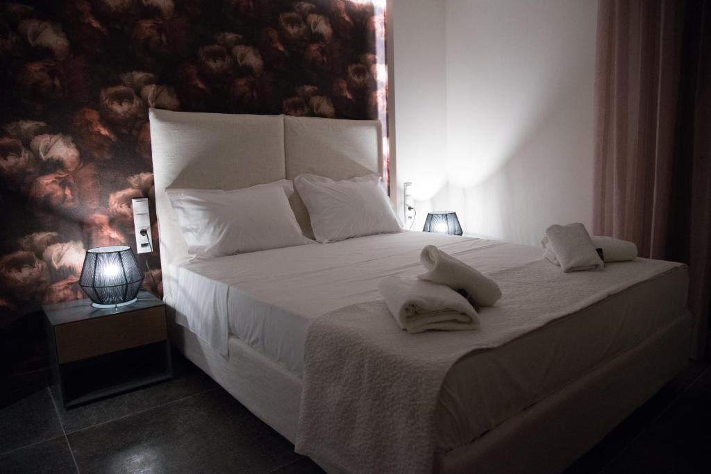 Postel nebo postele na pokoji v ubytování Loutraki Hidden Gem V