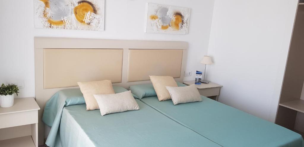 Postel nebo postele na pokoji v ubytování Hotel Sur