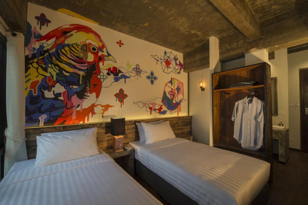 Postel nebo postele na pokoji v ubytování Cacha Hotel