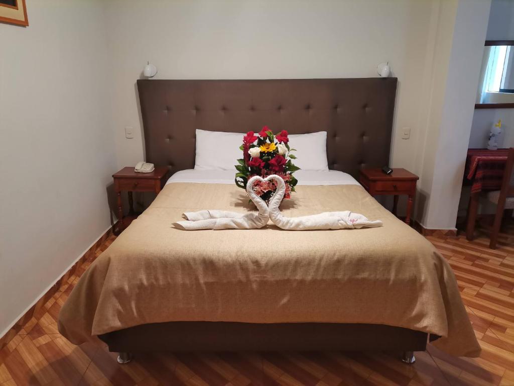 Postel nebo postele na pokoji v ubytování Hotel Urpi Cusco