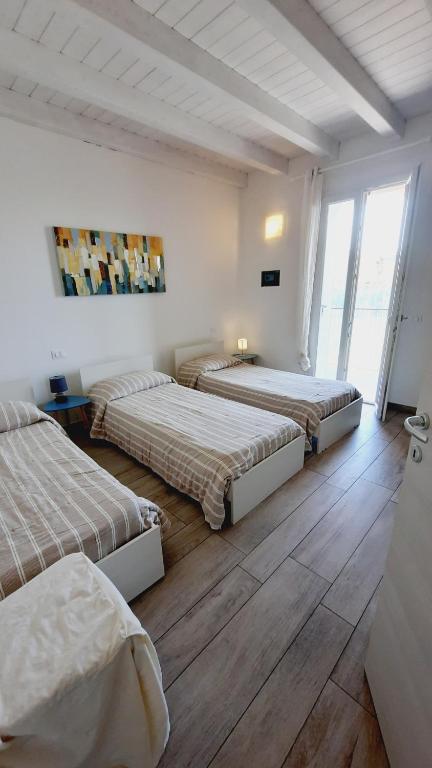 Posteľ alebo postele v izbe v ubytovaní Villaggio Esmera