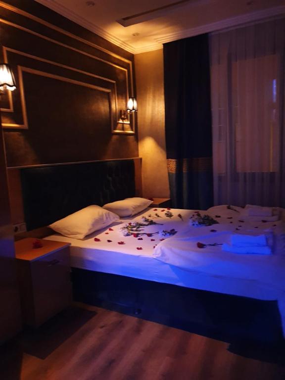 A bed or beds in a room at BoNaMi Hotel