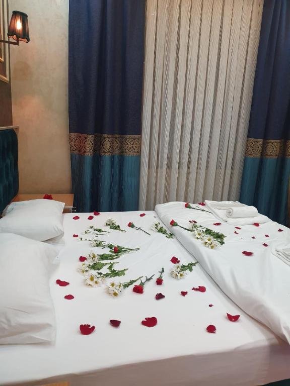 A bed or beds in a room at BoNaMi Hotel