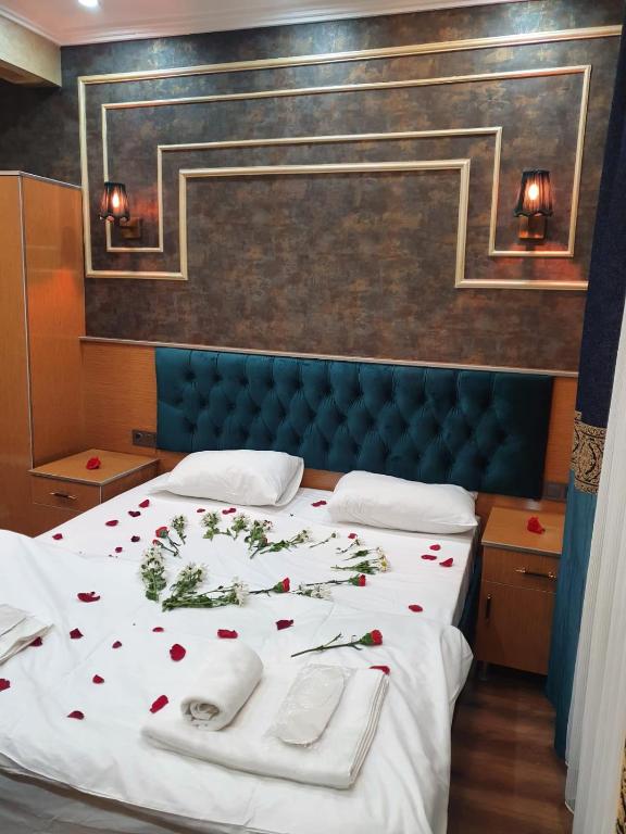 A bed or beds in a room at BoNaMi Hotel