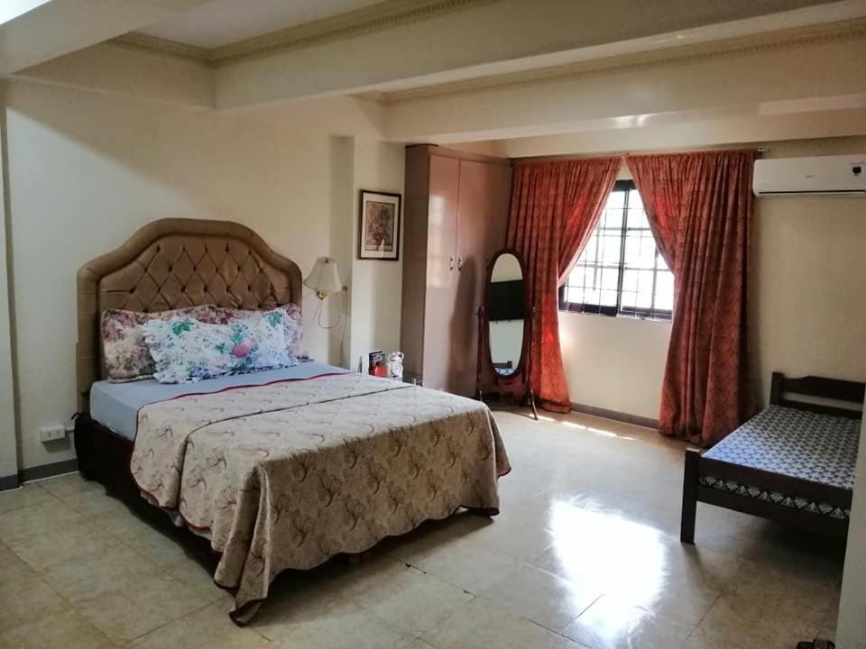 Łóżko lub łóżka w pokoju w obiekcie The Saint Joseph Residential Suites