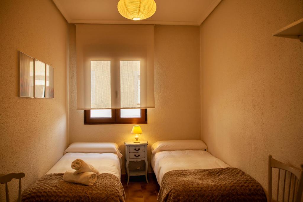 Postel nebo postele na pokoji v ubytování CASA TEO
