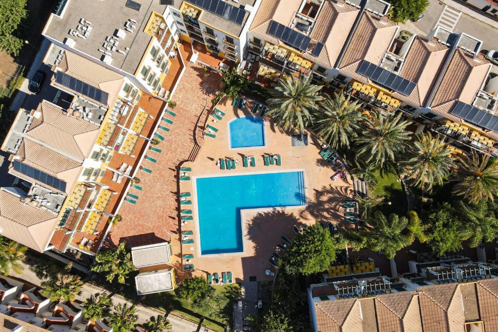 an aerial view of a resort with a swimming pool at Grupo Morgado - Quinta do Morgado - Morgado House in Tavira