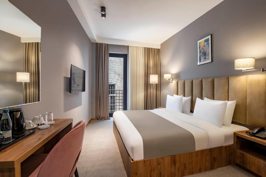 TV a/nebo společenská místnost v ubytování Barnovi Boutique Hotel