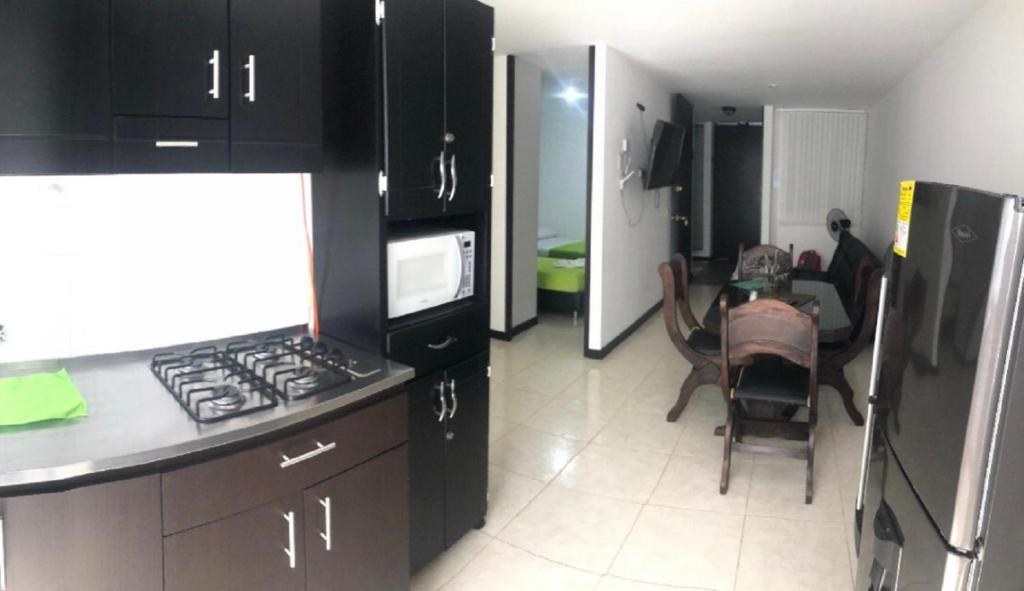 Kuchyň nebo kuchyňský kout v ubytování Apartahotel en el eje cafetero cerca al Parque del Café