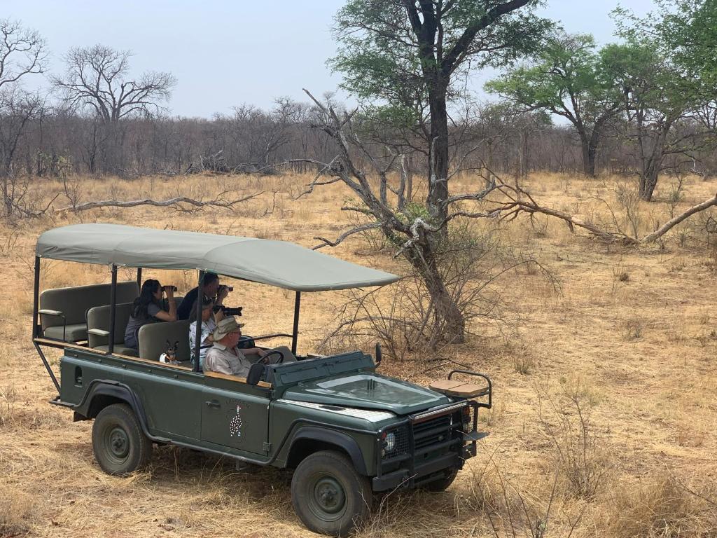 a group of people riding in a safari vehicle at Ngangane Lodge & Reserve in Francistown