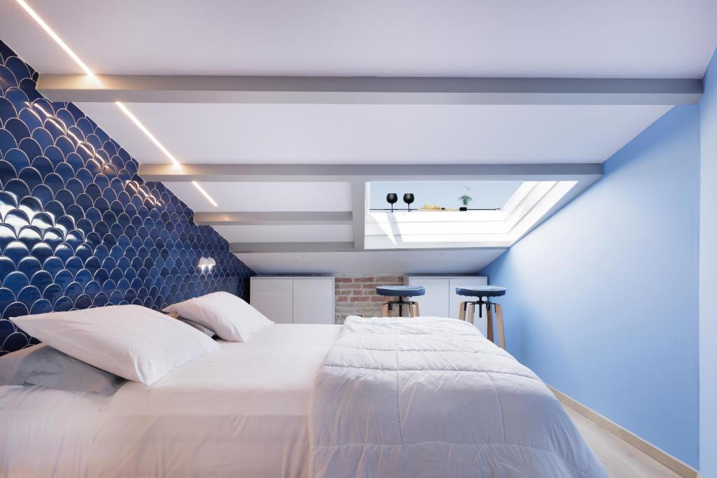 Postel nebo postele na pokoji v ubytování Vailato Loft Suites