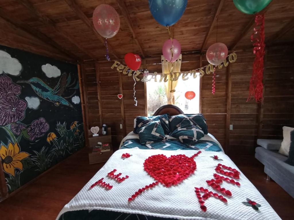 Postel nebo postele na pokoji v ubytování Cabaña Sueños Dorados