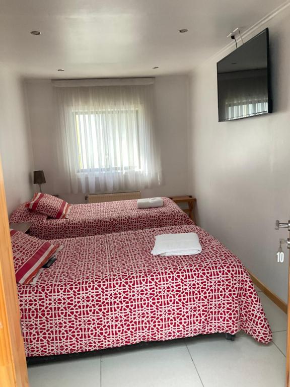 Letto o letti in una camera di Hostal Balmaceda