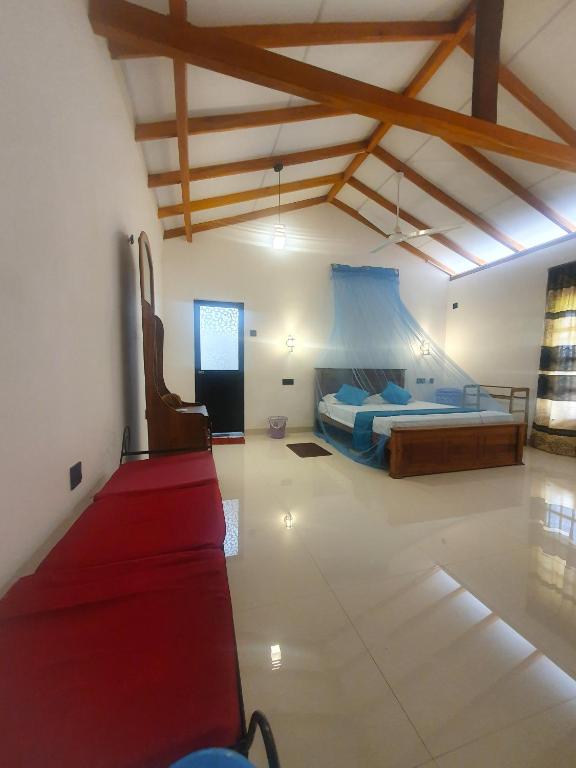 Postel nebo postele na pokoji v ubytování Villa Kubura Mirissa