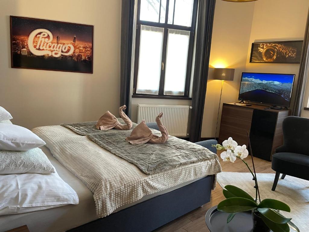 Postel nebo postele na pokoji v ubytování Chicago Vendégház