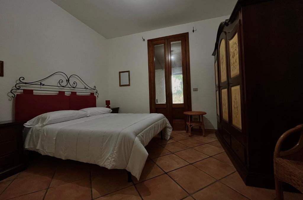 Posteľ alebo postele v izbe v ubytovaní villa Dimora Arnesano