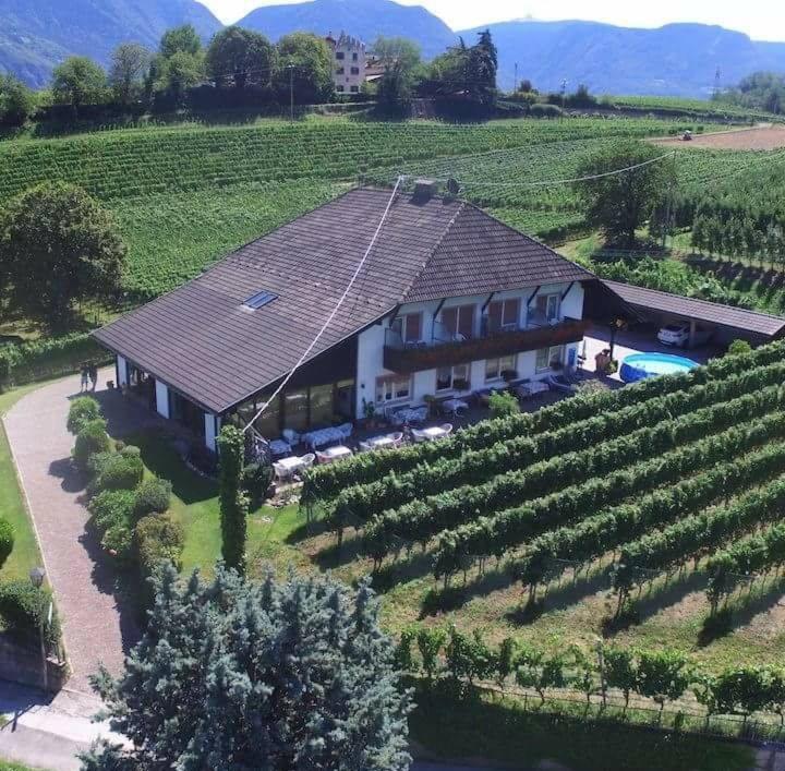 an aerial view of a house in a vineyard at Landhaus Weingut in Cornaiano