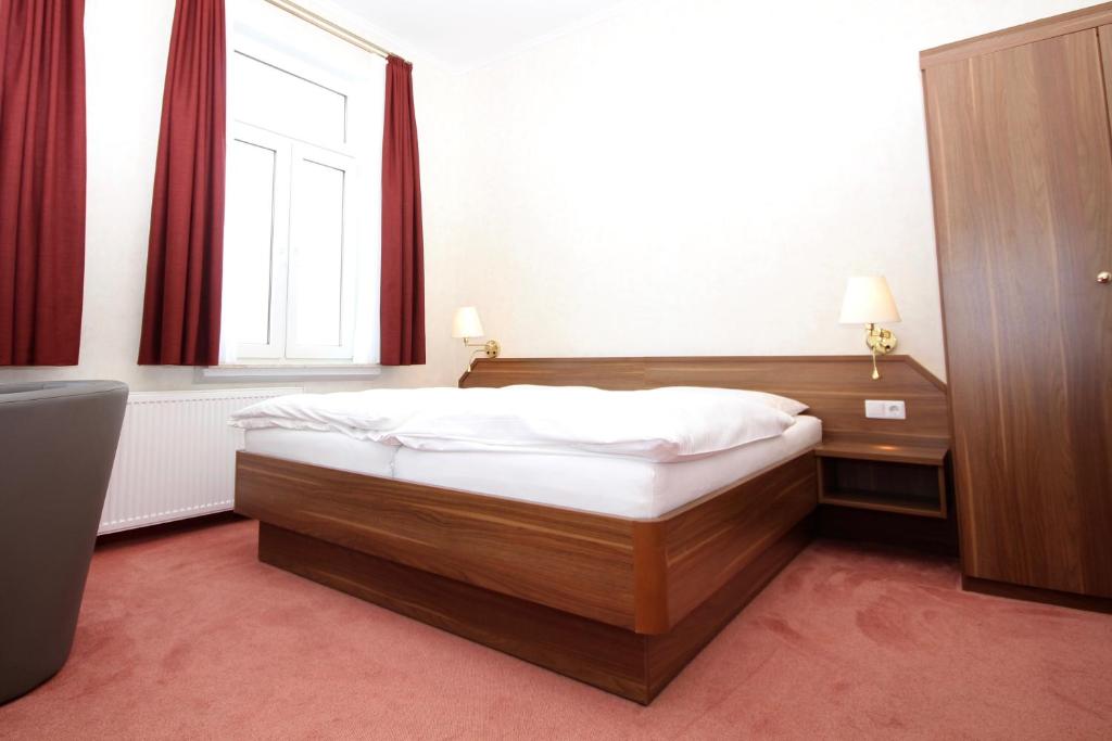 Postel nebo postele na pokoji v ubytování Haus Seeblick