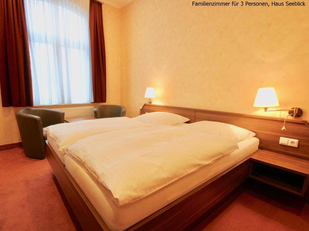 Postel nebo postele na pokoji v ubytování Haus Seeblick