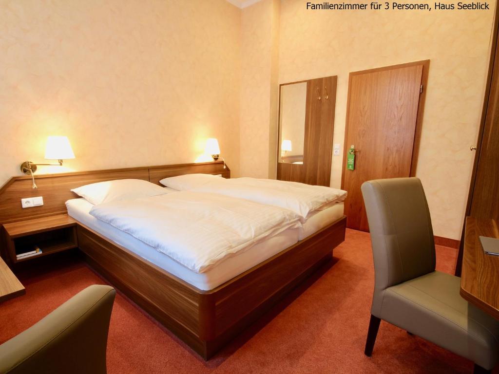 Postel nebo postele na pokoji v ubytování Haus Seeblick