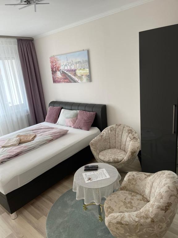 Łóżko lub łóżka w pokoju w obiekcie Classic City Apartman