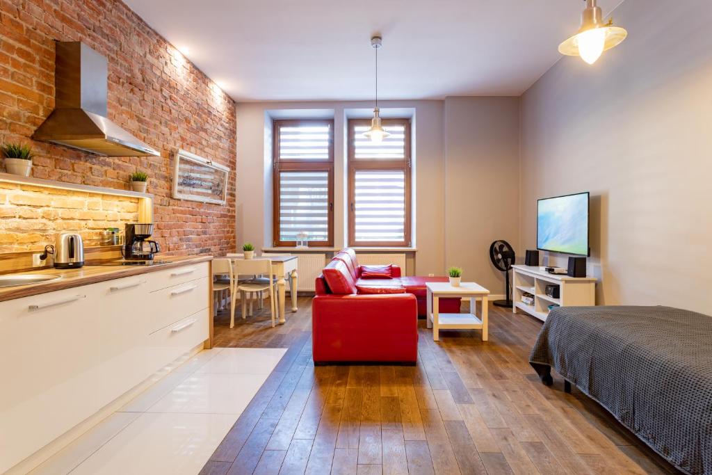 Kuchyňa alebo kuchynka v ubytovaní Apartamenty Łazarza 17