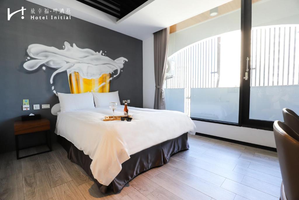 Postel nebo postele na pokoji v ubytování Hotel Initial-Beer