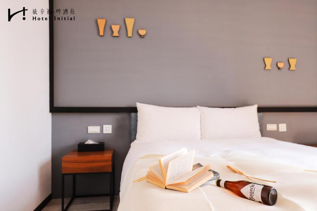 Postel nebo postele na pokoji v ubytování Hotel Initial-Beer
