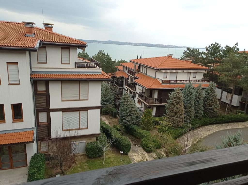 a view of some houses and the water at Lilia Sun Apartment in Sozopol