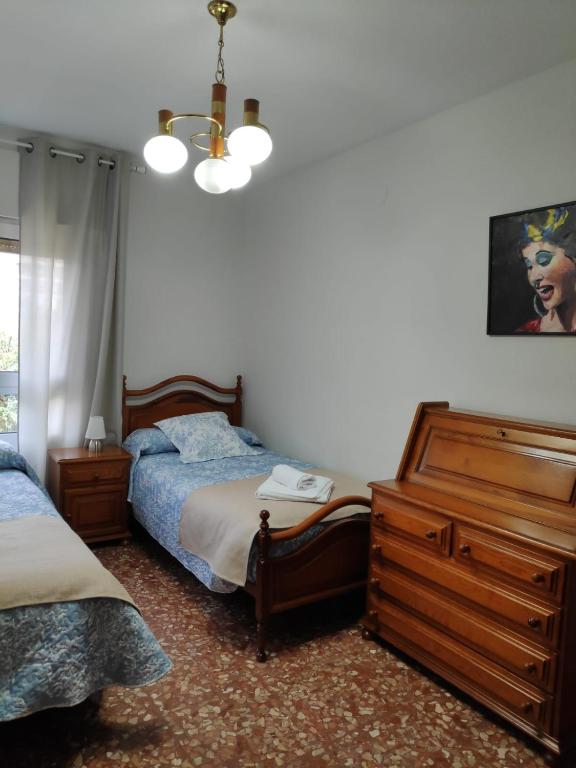 Postel nebo postele na pokoji v ubytování Alquiler Vacacional Carlos III
