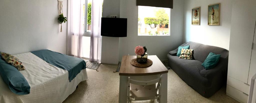 Posedenie v ubytovaní Loft con acceso a piscina