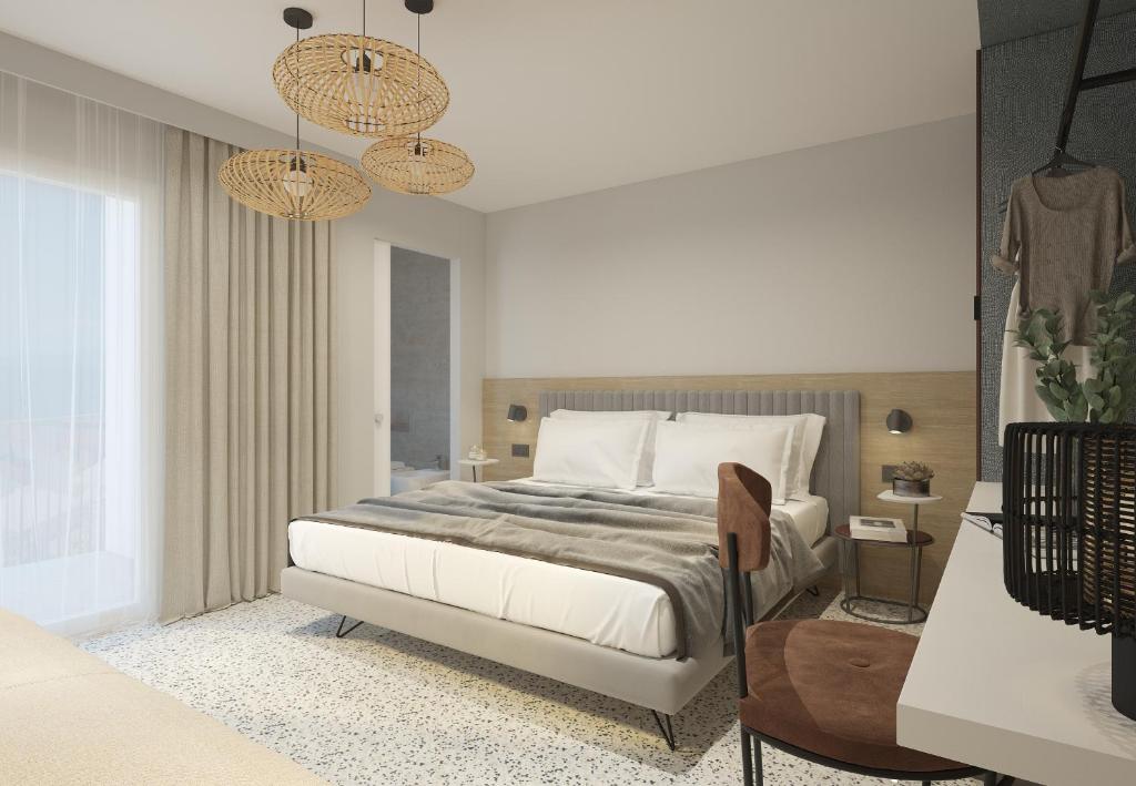 Postel nebo postele na pokoji v ubytování Hotel Sirenetta