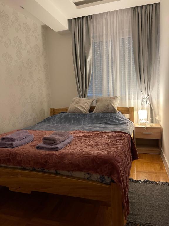 Postel nebo postele na pokoji v ubytování Apartman MDB