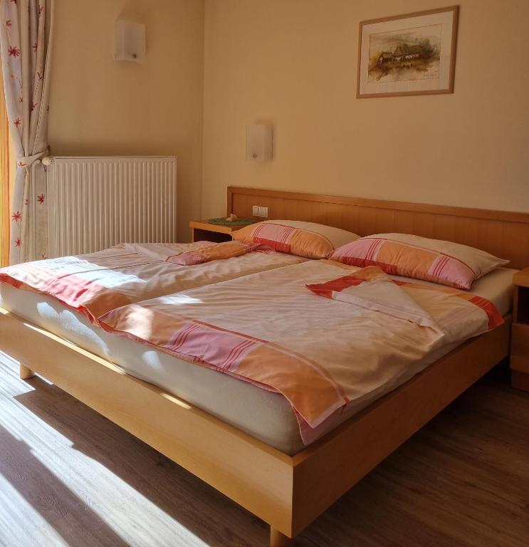 Postel nebo postele na pokoji v ubytování Apartments AD Radenci
