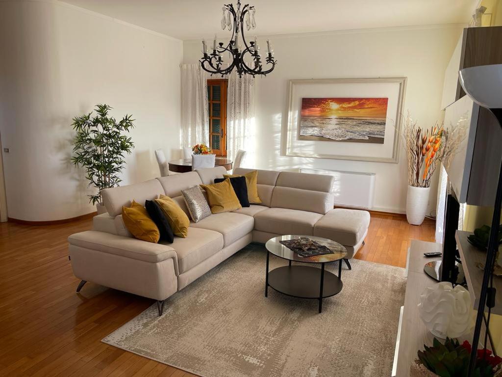 a living room with a couch and a table at Casa Riviera in Lavagna