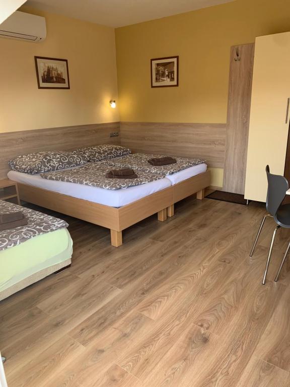 Postel nebo postele na pokoji v ubytování Apartmany Hujer
