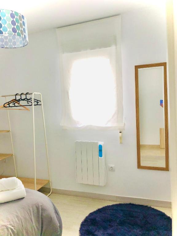 Posteľ alebo postele v izbe v ubytovaní Apartamentos Cruz Granada